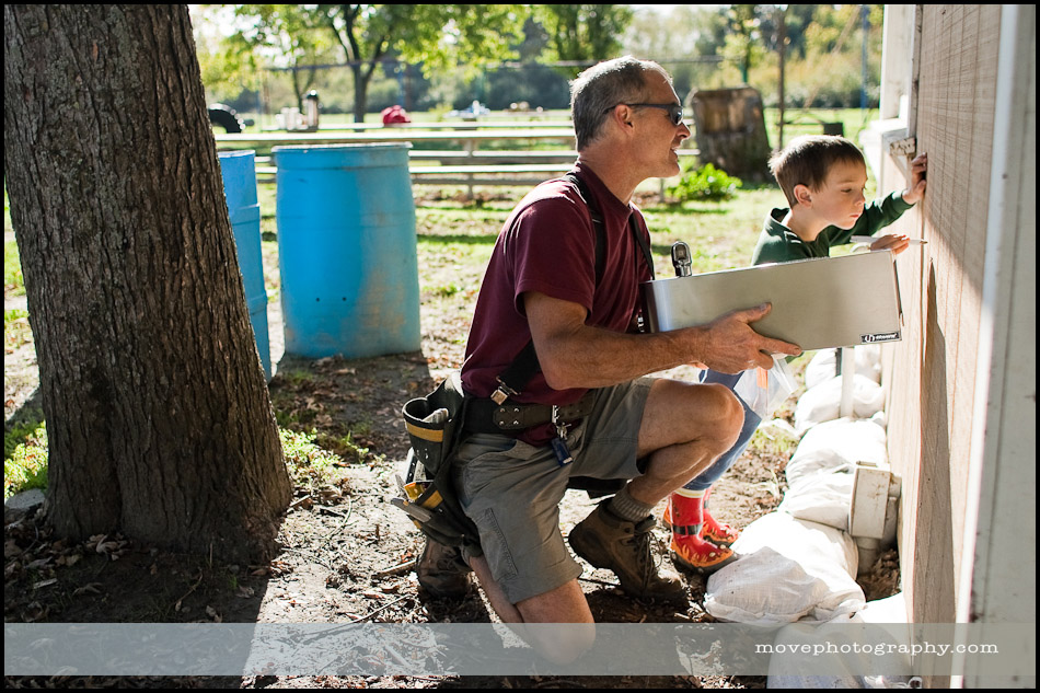 blog-003 Penngrove contractor David Valente's son, Michael, 4, marks a height near where they plan to install a water fountain at Penngrove Community Park during a park cleanup organized by the Penngrove Social Firemen Saturday morning.